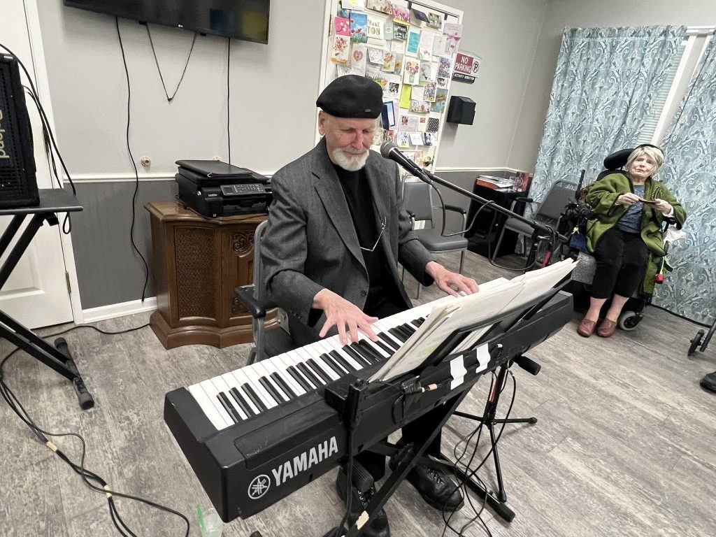 Senior man playing the keyboard